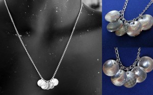 Textured disk necklace.
