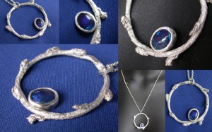 Cheery tree twig with organically set opal triplet