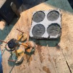 Sand-cast bronze bee pendants. Just poured