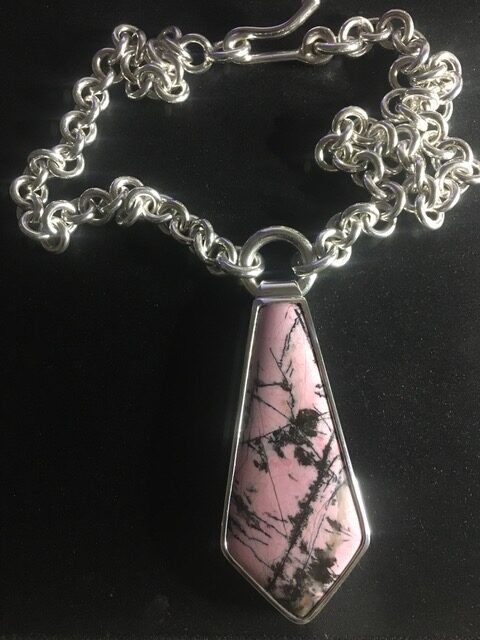 Hand cut Rhodonite crystal and sterling silver chain and setting